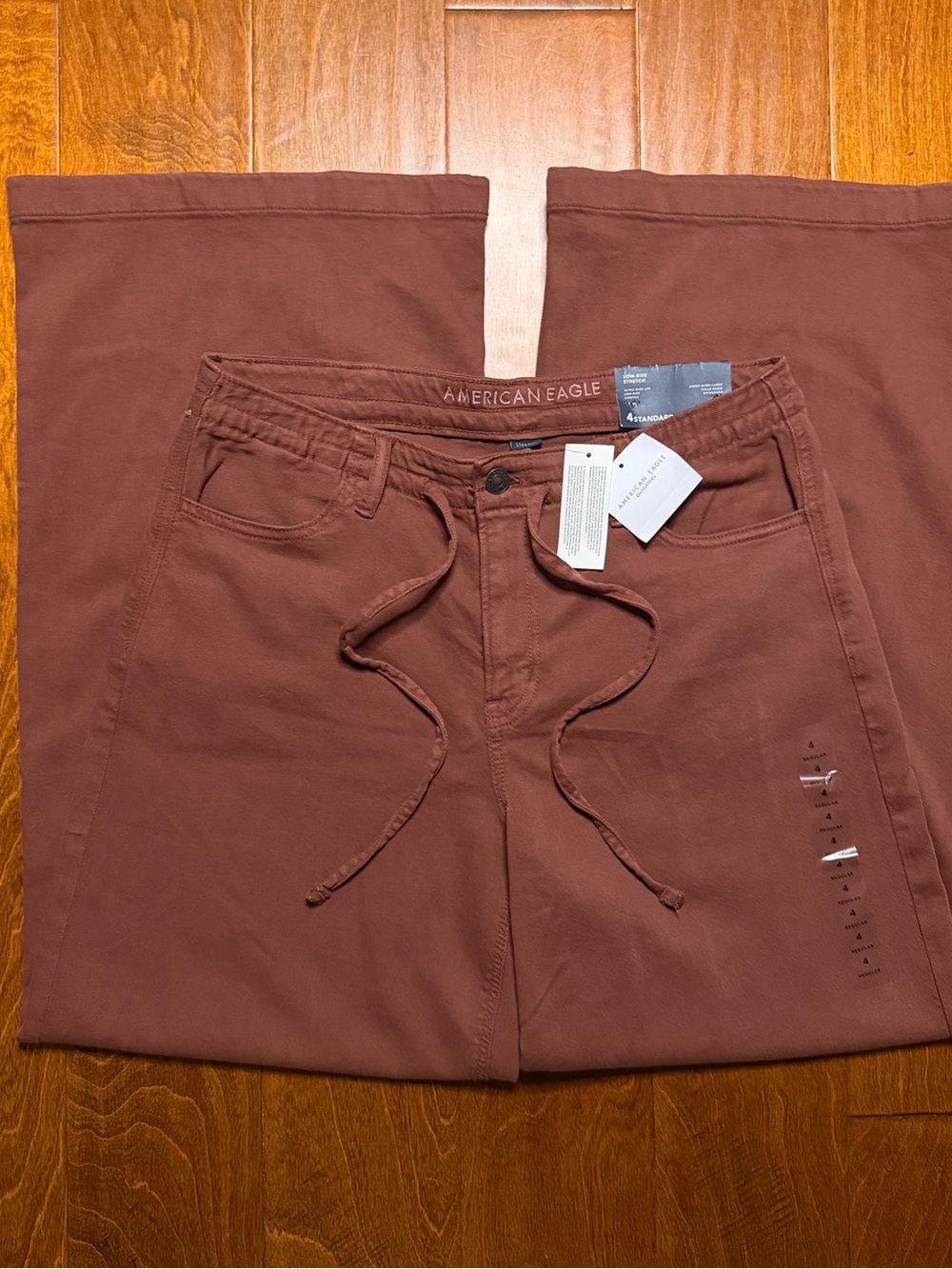 American Eagle burgundy brown low rise ultra wide leg jeans w drawstring waist